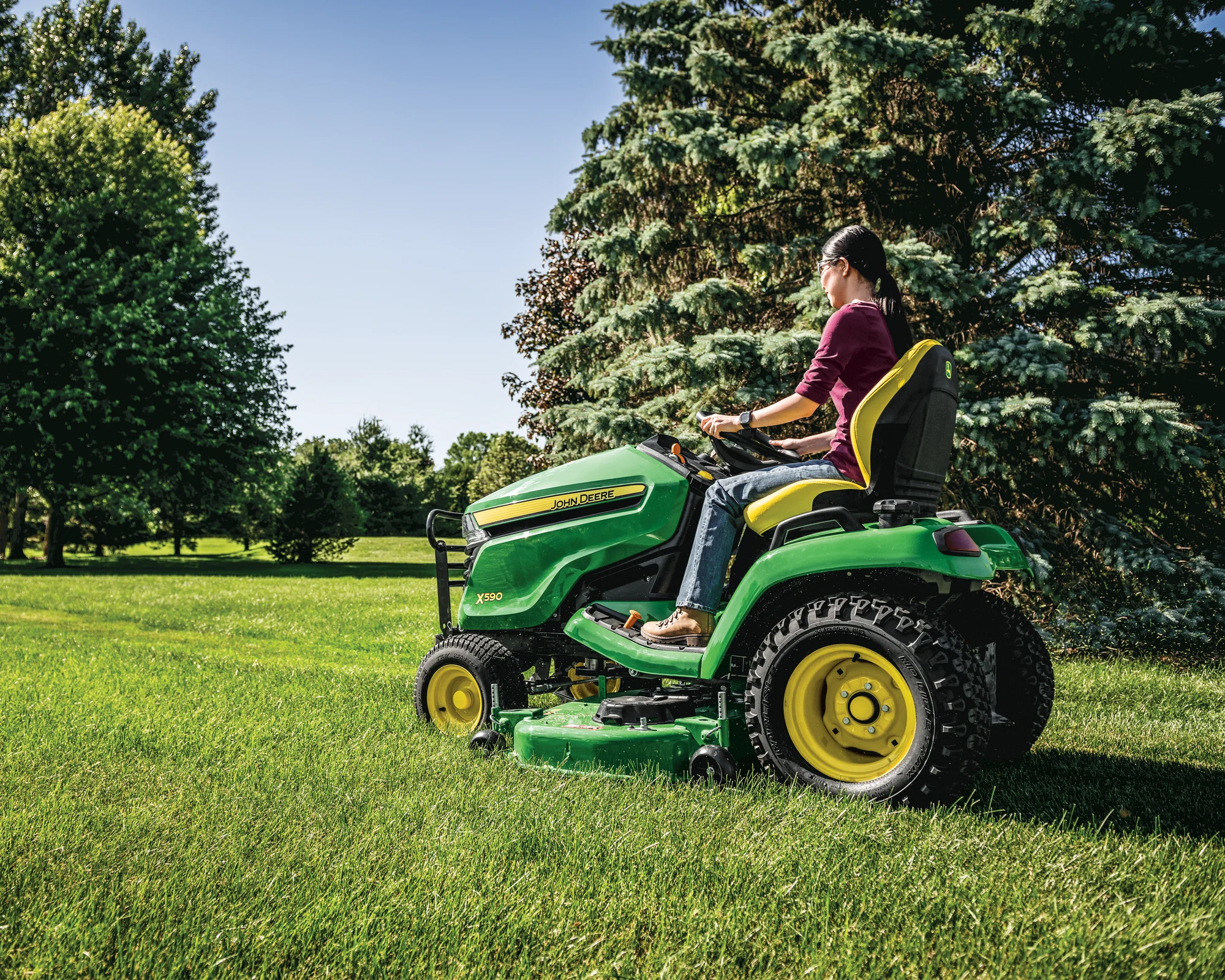 John Deere Select X500 Series Lawn Tractor X590 54 Back View Right Woman Mowing Lawn product image