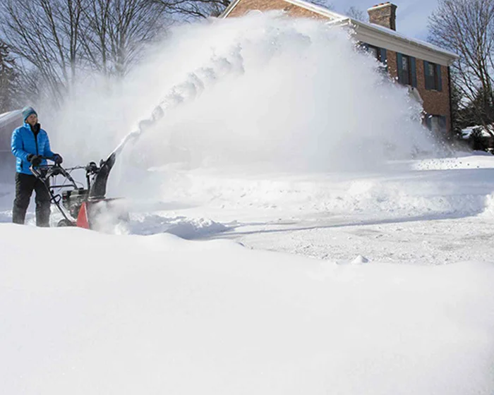 Toro SnowMaster Snow Blower 724 QXE 36002 Toro Snowmaster Series Two Stage Snow Blower 36002 Front View Wide In Use Sidewalk product image